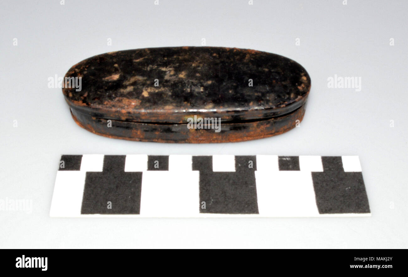 Black metal oval case found in medical kit. Probably contained medical instruments or equipment. Title: Medical Equipment Case  . circa 1810. Stock Photo