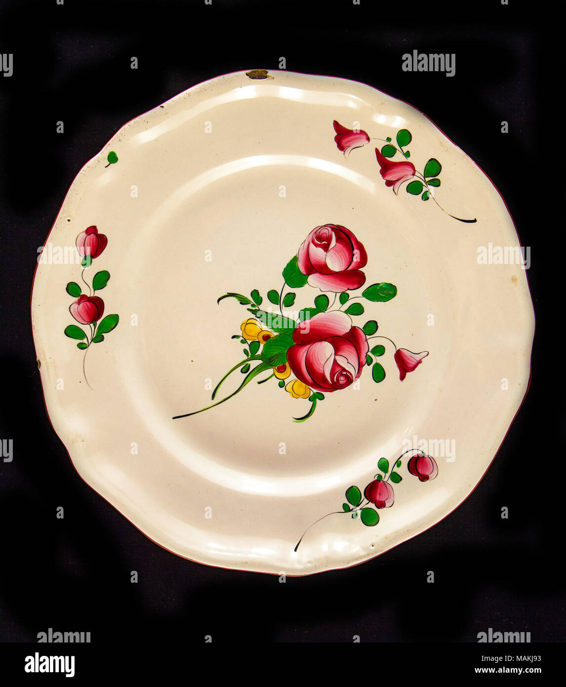 French faience, tin-glazed earthenware plate with floral decorations. Belonged to Auguste Chouteau and descended through the Chouteau family. Title: French Ceramic Plate from Chouteau Family  . circa 1800. Stock Photo