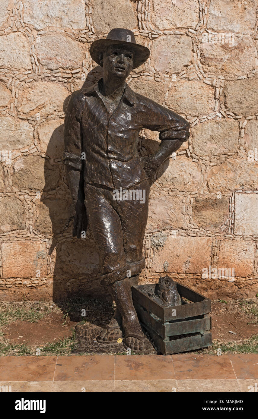 Bronze statue fisherman on the city wall of San Francisco de Campeche