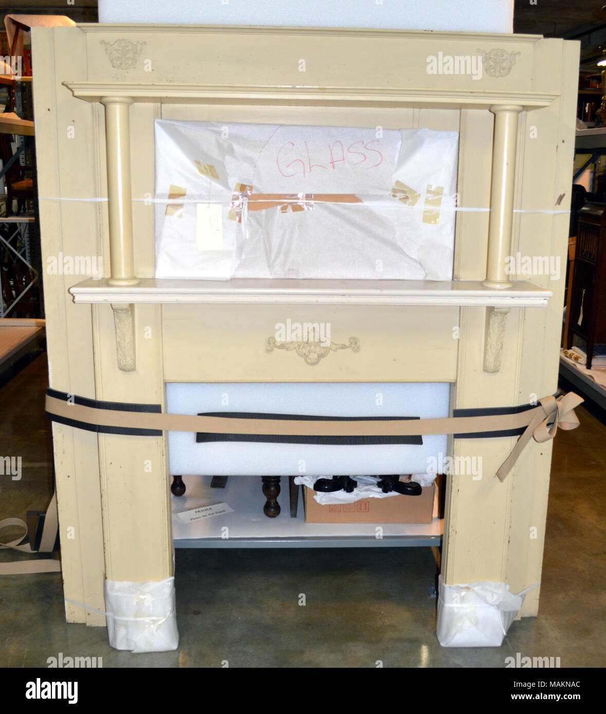 Cream Painted Wooden Mantel With Double Shelves And Iron Fireplace