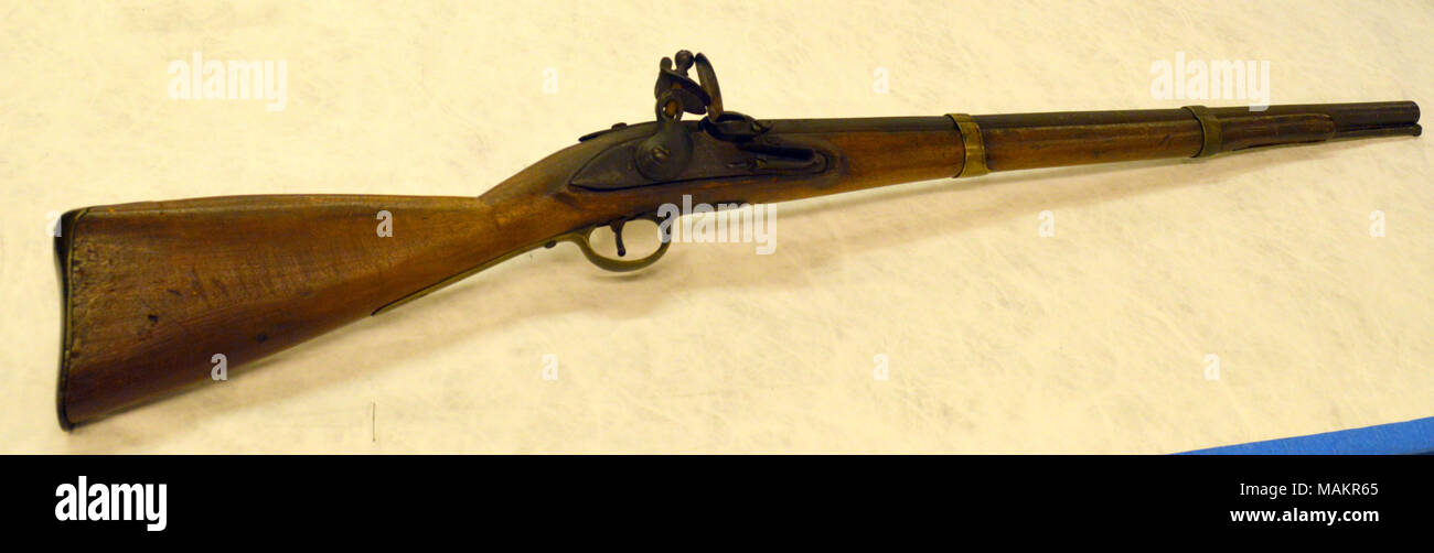 Restocked flintlock musket with pieces from multiple firearms including a British India Pattern Brown Bess lock, trigger guard and buttplate, and with brass barrel bands, similar to those used on the U.S. M1842 Musket and U.S. M1841 Rifle Title: 19th Century Flintlock Musket  . between 1797 and 1854. Stock Photo