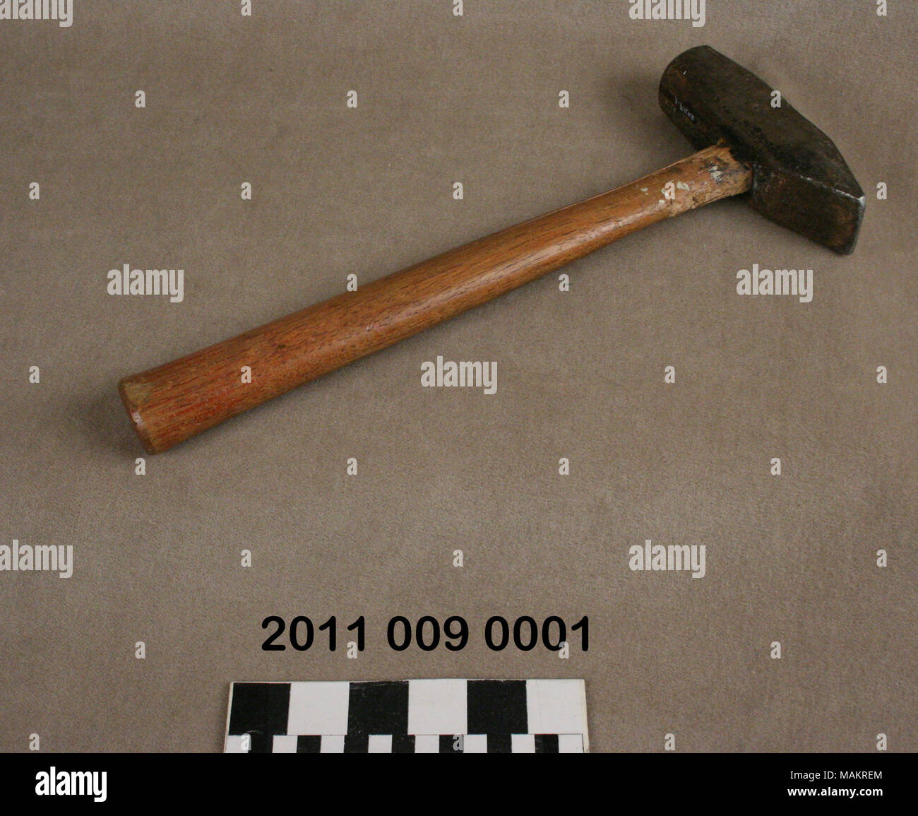 Masonry hammer with cracked wood handle Title Masonry Hammer . circa
