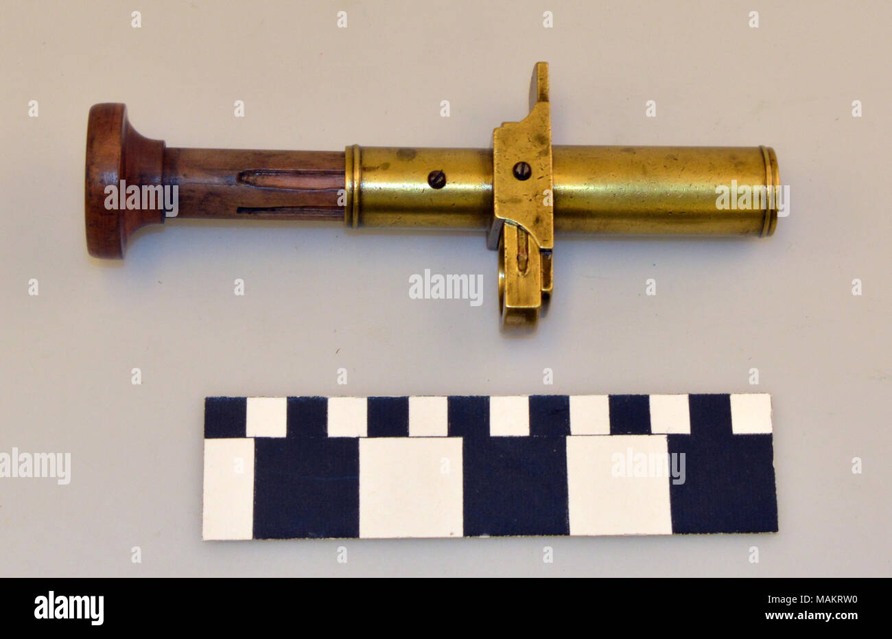 Reloading tool for 10 gauge shotgun shells consists of a brass