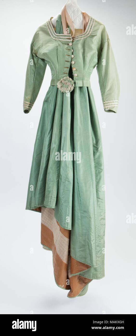 Green silk faille wedding dress with white trimmings. Title: Green Silk