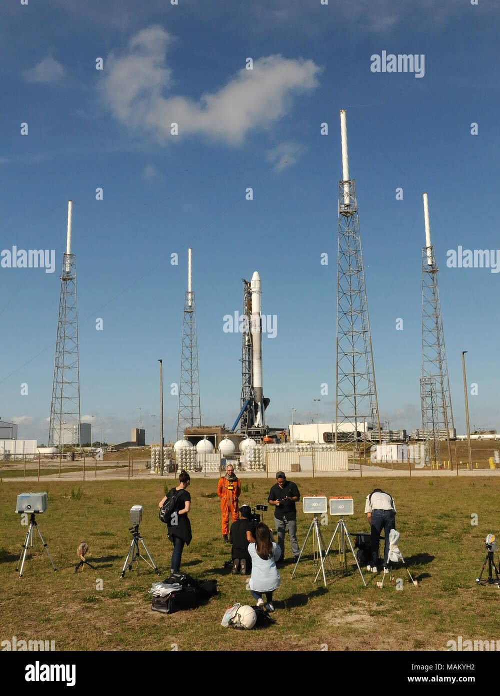 Cape Canaveral, Florida, United States. April 2, 2018 - Members of the media photograph a SpaceX Falcon 9 rocket as it stands ready for launch on April 2, 2018 at launch complex 40 at Cape Canaveral Air Force Station in Florida. The rocket is carrying a Dragon spacecraft containing 5,800 pounds of supplies for the International Space Station (ISS). This is the 14th ISS resupply mission by SpaceX for NASA. (Paul Hennessy/Alamy) Credit: Paul Hennessy/Alamy Live News Stock Photo