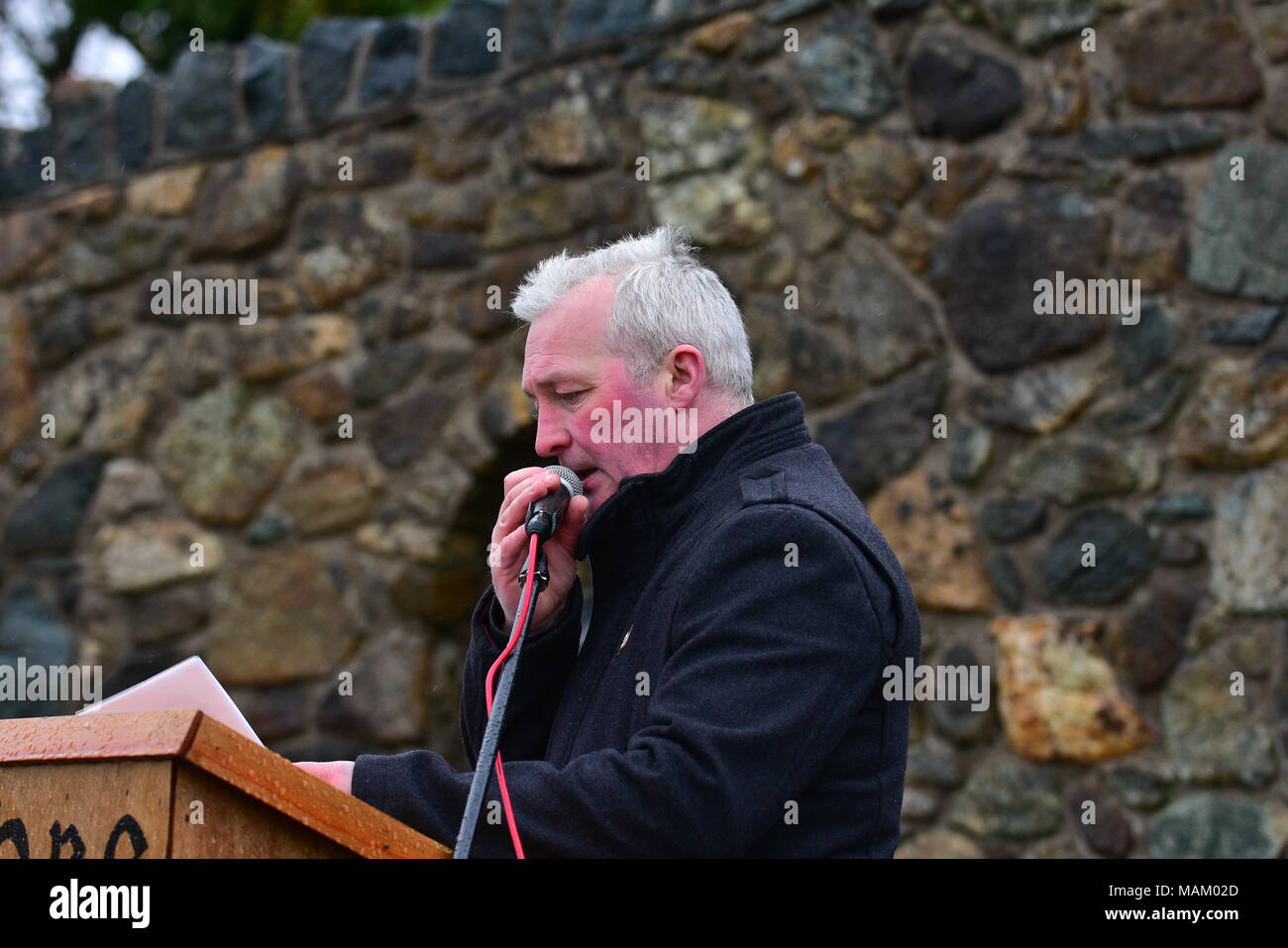 Carrickmore, UK. 2nd April, 2018. Tyrone National Graves Association official Eamon Hanna gives the opening speech at  the annual Commemoration took place in Carrickmore, on Easter Monday, upwards of 300 people attended the annual remembrance. Tyrone: UK: 2nd April 2018 Credit: Mark Winter/Alamy Live News Stock Photo