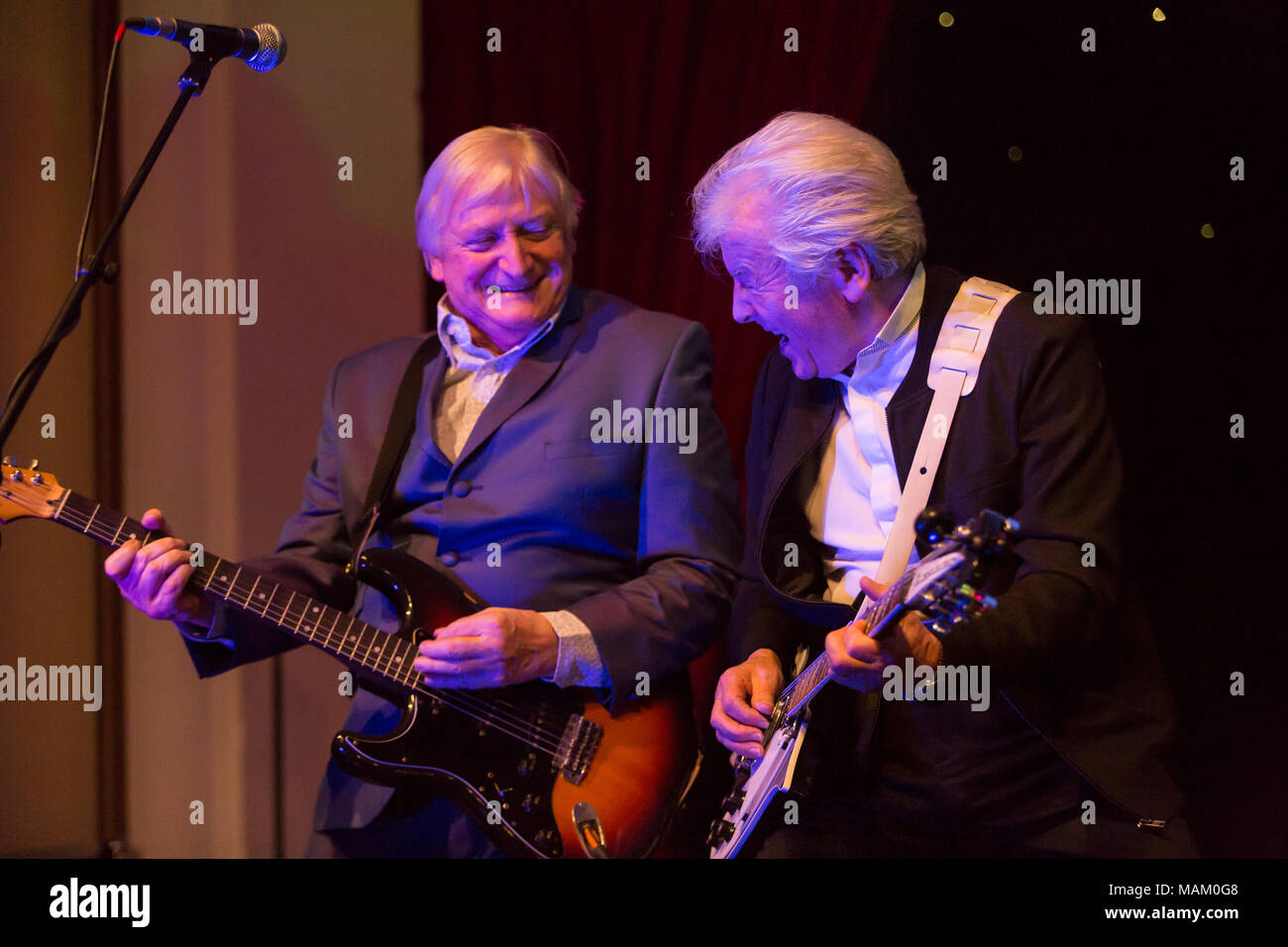 Nantwich, Cheshire, UK. 2nd April, 2018. Mike Pender from The Searchers rocks out with Eddie Wheeler of Vanity Fare at the Nantwich Civic Hall as part of the Oh Boy It's the non-stop Sixties show during the 22nd Nantwich Jazz, Blues and Music Festival. Credit: Simon Newbury/Alamy Live News Stock Photo