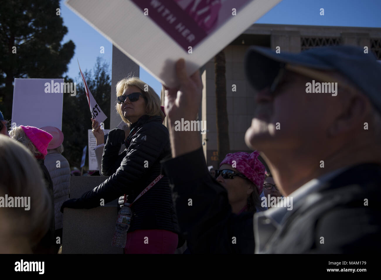 Phoenix, Arizona, USA. 21st Jan, 2018. KIM BARTLETT, of Scottsdale, holds a sign during a rally before the second annual Women's March to the Polls at the Arizona State Capitol in Phoenix on Sunday, Jan. 21, 2018. Credit: Ben Moffat/via ZUMA Wire/ZUMA Wire/Alamy Live News Stock Photo