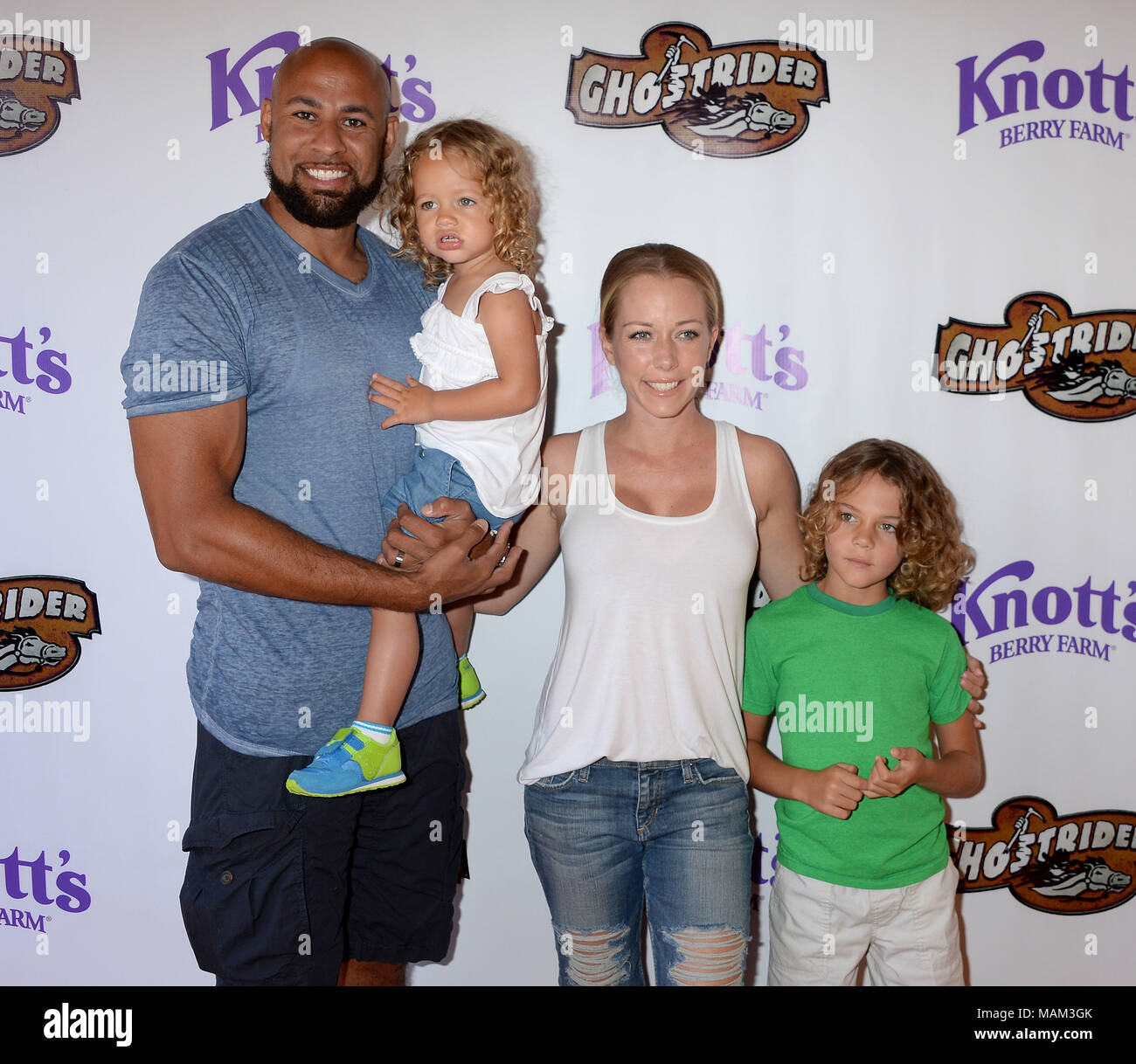 BUENA PARK, CA - JUNE 04: Kendra Wilkinson and Jiffpom attend the GhostRider Reopening at Knott's Berry Farm on June 4, 2016 in Buena Park, California.  People:  Kendra Wilkinson, husband Hank Baskett, daughter Alijah Mary Baskett, son Hank Baskett IV Stock Photo