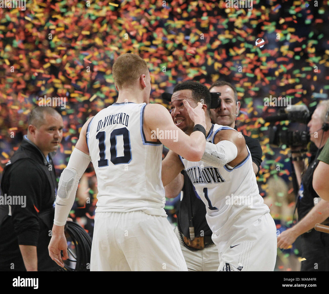 San Antonio, USA. 2nd Apr, 2018. Jalen Brunson (R) of Villanova celebrates with his teammate Donte DiVincenzo after beating Michigan with 79-62 in the championship game of the Final Four NCAA college basketball tournament, in San Antonio, Texas, the United States, on April 2, 2018. Credit: Song Qiong/Xinhua/Alamy Live News Stock Photo