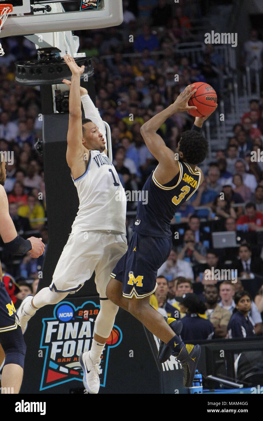 San Antonio, USA. 2nd Apr, 2018. Jalen Brunson (L) of Villanova defends Zavier Simpson of Michigan during the championship game of the Final Four NCAA college basketball tournament, in San Antonio, Texas, the United States, on April 2, 2018. Villanova claimed the title by defeating Michigan with 79-62. Credit: Song Qiong/Xinhua/Alamy Live News Stock Photo