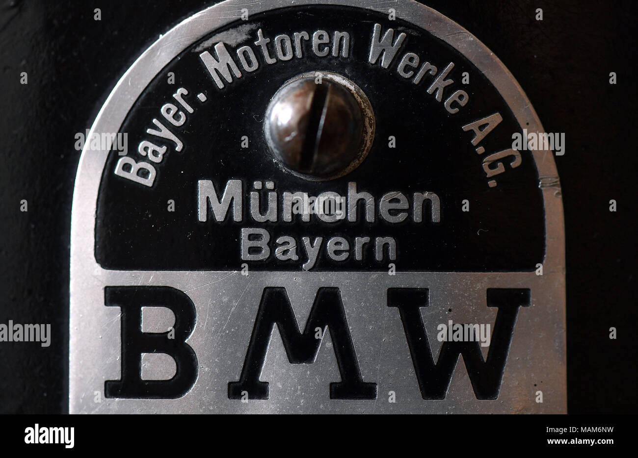 27 March 2018, Germany, Augustusburg: The nameplate of the BMW racing  machine WR 750 Kompressor from 1935 in the new special exhibition in the  Motorcycle Museum Schloss Augustusburg. The exhibition with the