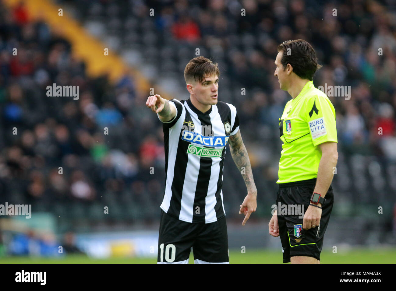 Udine, Italy. 3rd April, 2018. ITALY, Udine: Udinese's forward Rodrigo De Paul (L) speaks with Referee Luca Banti during the Serie A football match between Udinese Calcio v AC Fiorentina at Dacia Arena Stadium on 3rd April, 2018. Credit: Andrea Spinelli/Alamy Live News Stock Photo