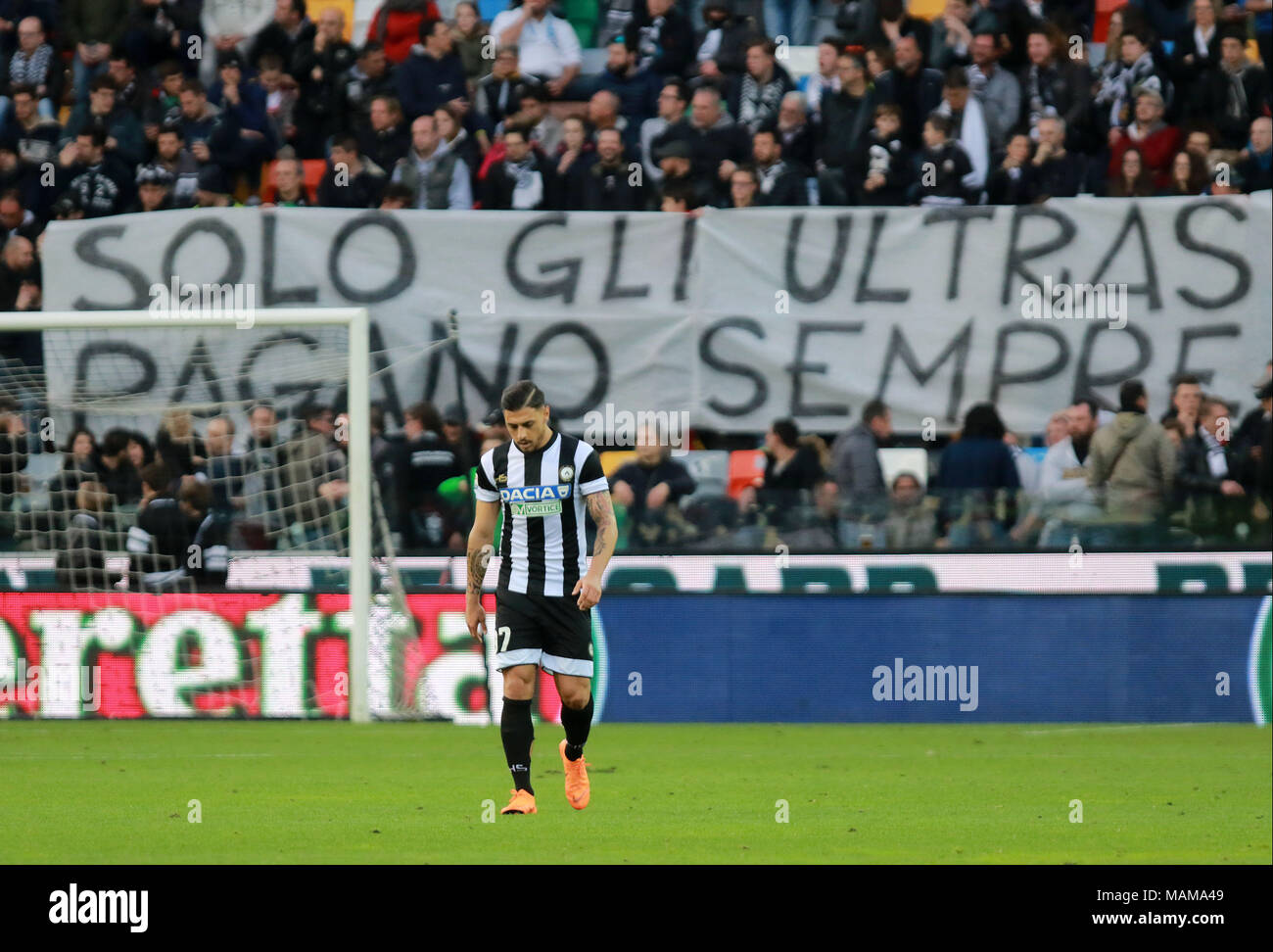 Udine, Italy. 3rd April, 2018. ITALY, Udine: Udinese's forward Giuseppe Pezzella behind him Udines's supporters shows a banner of protest during the Serie A football match between Udinese Calcio v AC Fiorentina at Dacia Arena Stadium on 3rd April, 2018. Credit: Andrea Spinelli/Alamy Live News Stock Photo