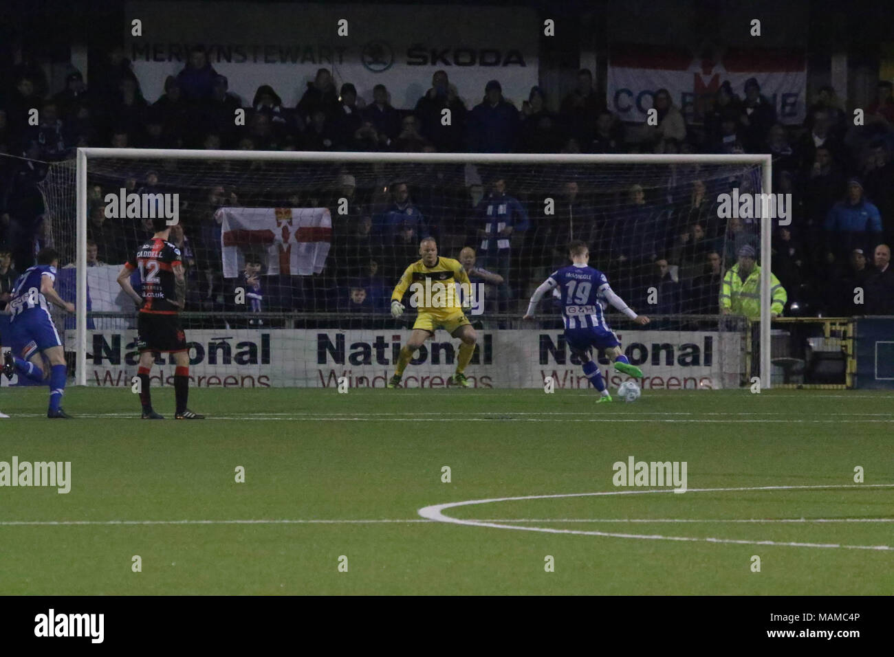 Seaview, Belfast, Northern Ireland, UK. 03 April 2018. Danske Bank Premiership - Crusaders 1 Coleraine 1. In tonight's top of the table clash at a packed Seaview, Crusaders drew 1-1 with Coleraine. The draw keeps Crusaders top of the league, two points ahead of Coleraine with four games to play. Coleraine's Jamie McGonigle (19) nets from the penalty spot. Credit: David Hunter/Alamy Live News. Stock Photo