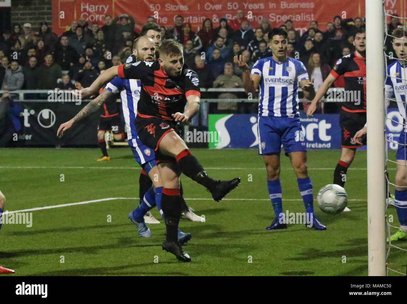 Seaview, Belfast, Northern Ireland, UK. 03 April 2018. Danske Bank Premiership - Crusaders 1 Coleraine 1. In tonight's top of the table clash at a packed Seaview, Crusaders drew 1-1 with Coleraine. The draw keeps Crusaders top of the league, two points ahead of Coleraine with four games to play. David Cushley fires in a late equaliser for Crusaders. Credit: David Hunter/Alamy Live News. Stock Photo