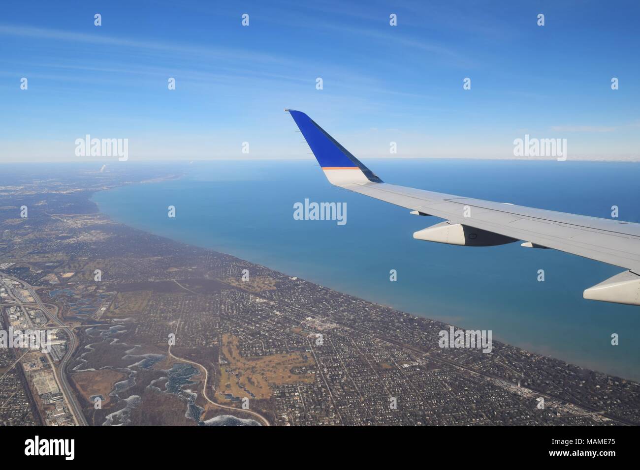 View of city and lake from plane Stock Photo