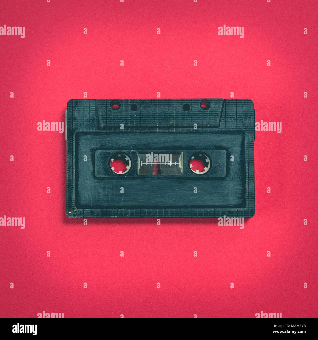 heart shape from cassette tape over paper background, top view Stock