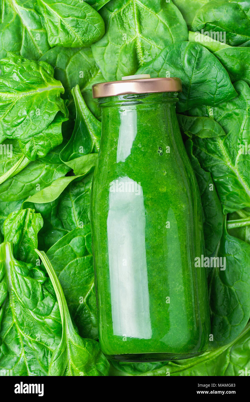 Bottle with Green Fresh Raw Smoothie from Leafy Greens Vegetables