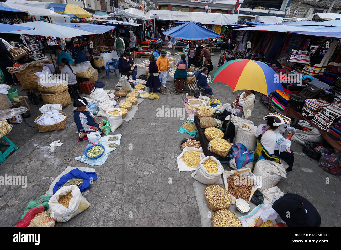 Otavalo, Ecuador-March 17, 2018: indigenous people selling produce in the Saturday market Stock Photo