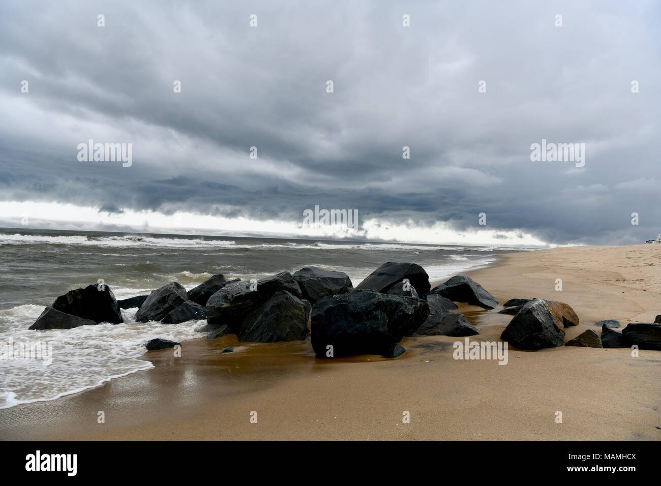 Storm clouds and rain moving across the Atlantic ocean directly off the coast of Ocean City, Maryland, USA Stock Photo