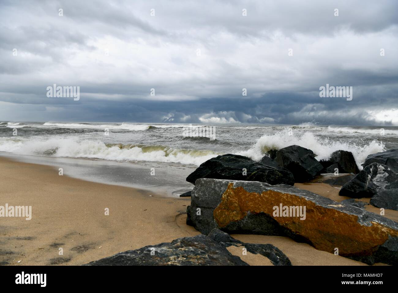 Storm clouds and rain moving across the Atlantic ocean directly off the coast of Ocean City, Maryland, USA Stock Photo