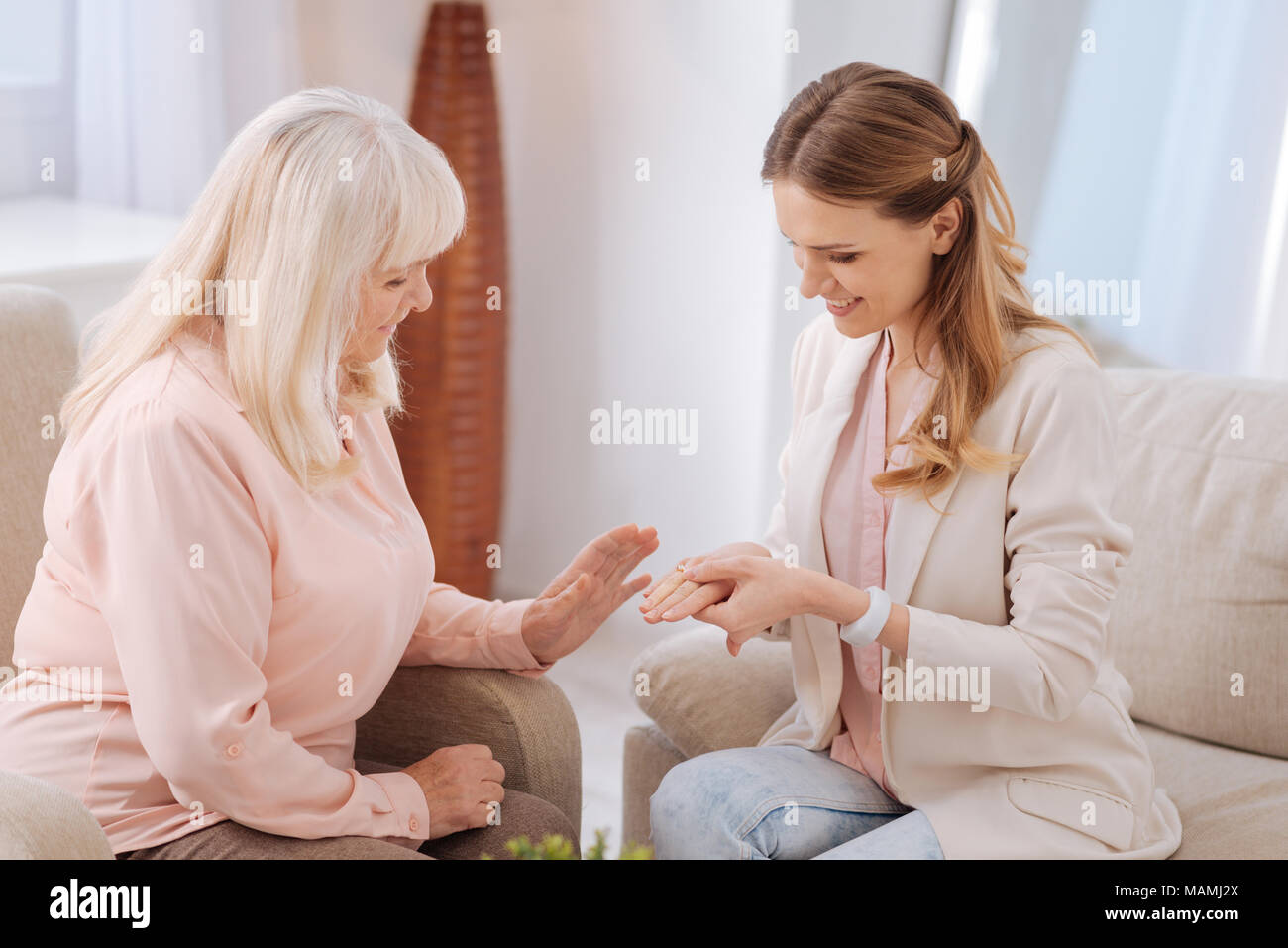 Positive joyful woman showing her ring Stock Photo - Alamy