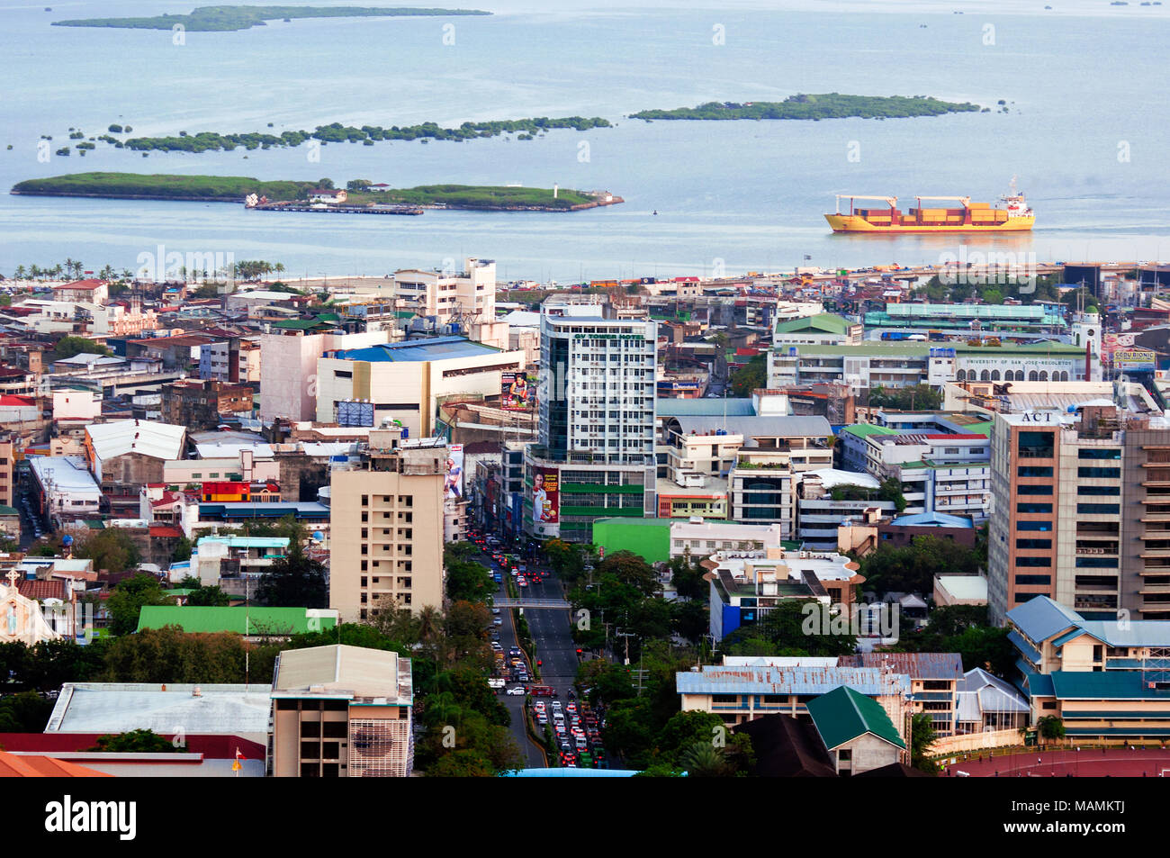 Aerial view of Cebu City looking east, with Osmena Boulevard, and Mactan Channel beyond, Philippines Stock Photo