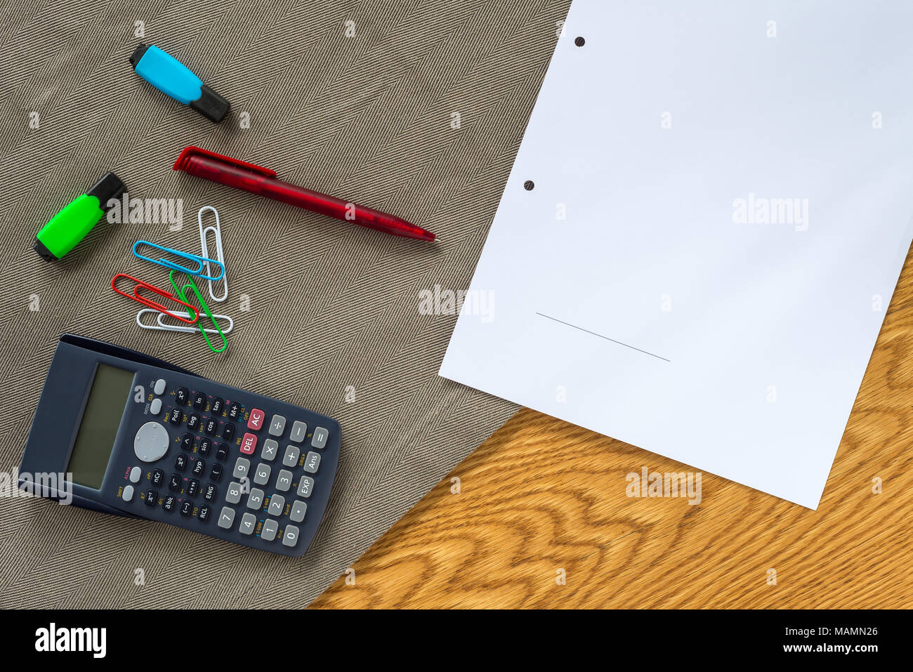 Accountant workspace as flat lay from above with paperwork and documents for signature and calculator with wooden background Stock Photo