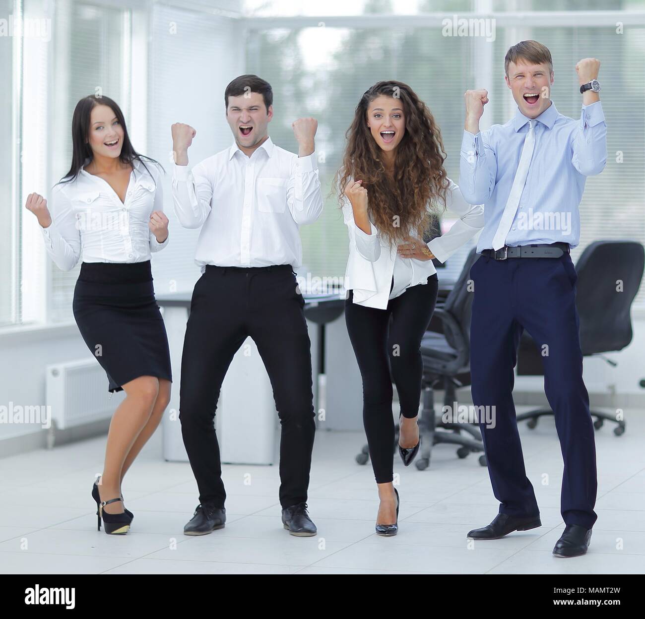 portrait of a triumphant business team Stock Photo - Alamy