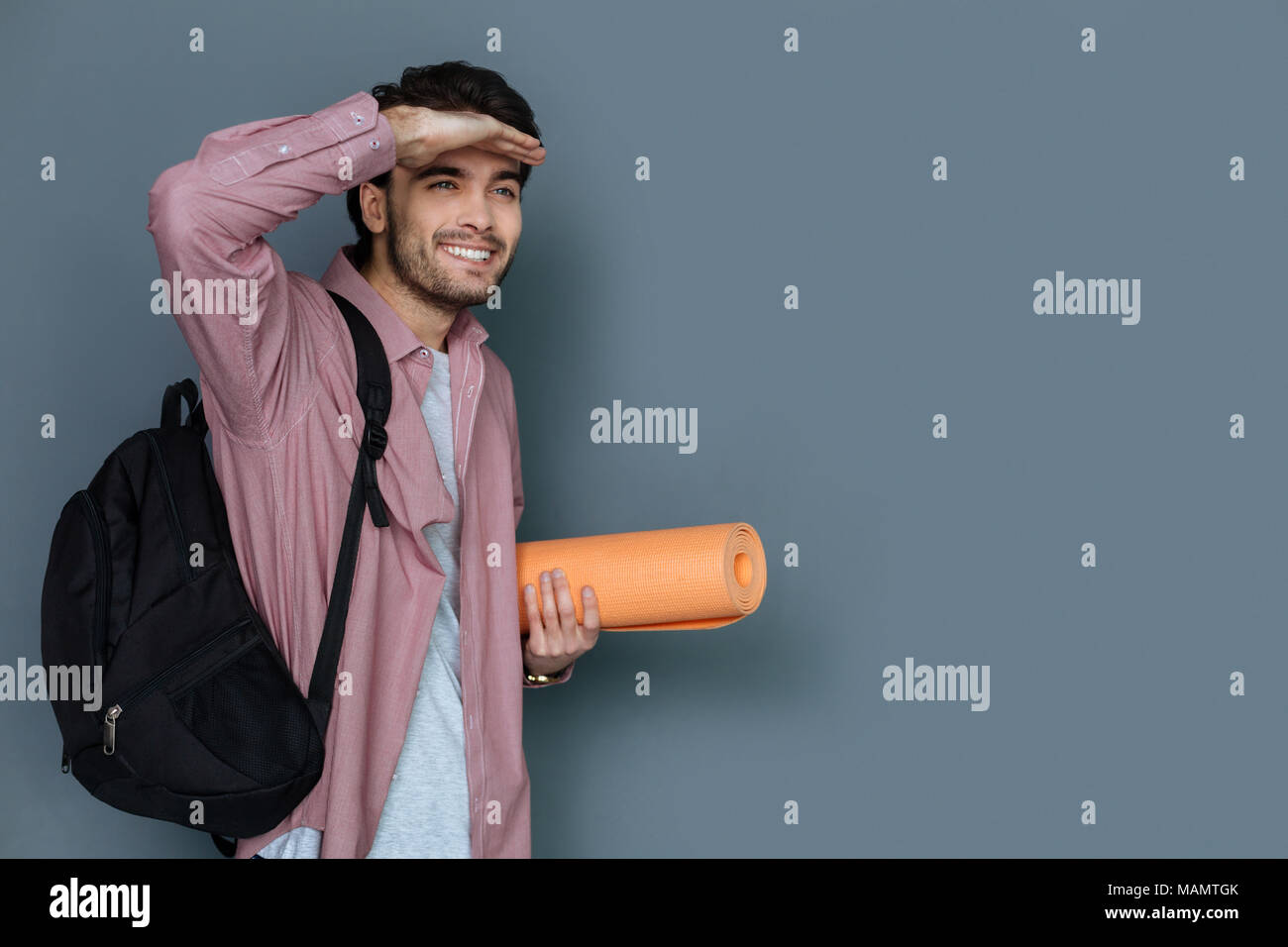 Nice joyful man having a walk Stock Photo