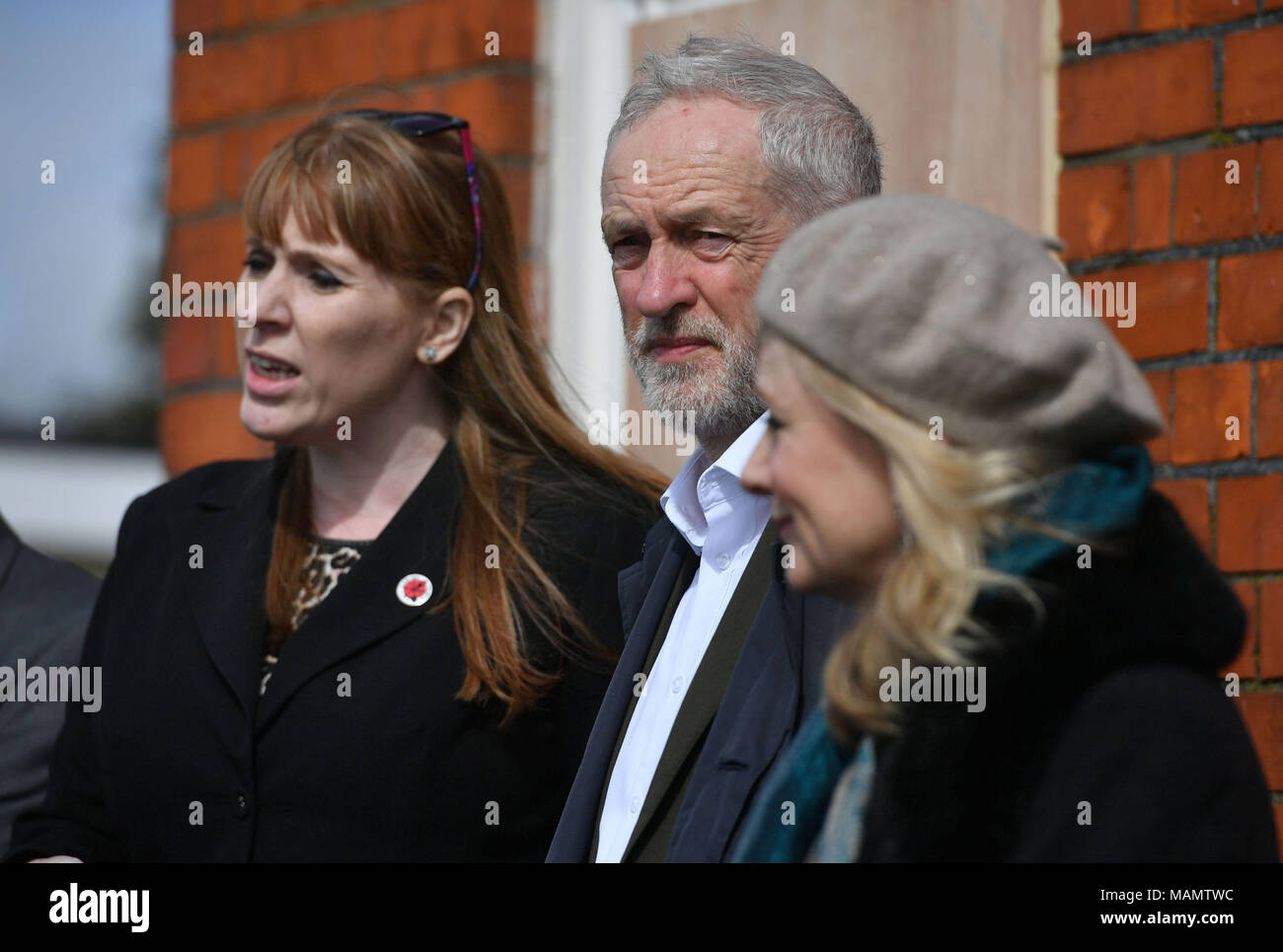 Labour leader Jeremy Corbyn with Shadow education secretary Angela Rayner (left) and MP for Batley and Spen Tracy Brabin (right) speaking outside The Old Pinehurst Library in Swindon about Labour's fight against cuts to Children and Young Peoples Services. Stock Photo