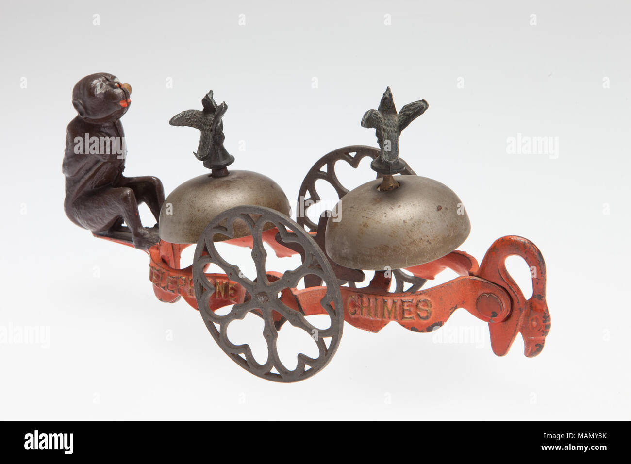 Hello Hello Telephone Chimes pull toy produced by the Gong Bell Manufacturing Company. The toy features a cast monkey and two ringing bells. Title: Hello Hello Telephone Chimes Bell Ringer Pull Toy  . between 1900 and 1920. Gong Bell Manufacturing Company Stock Photo