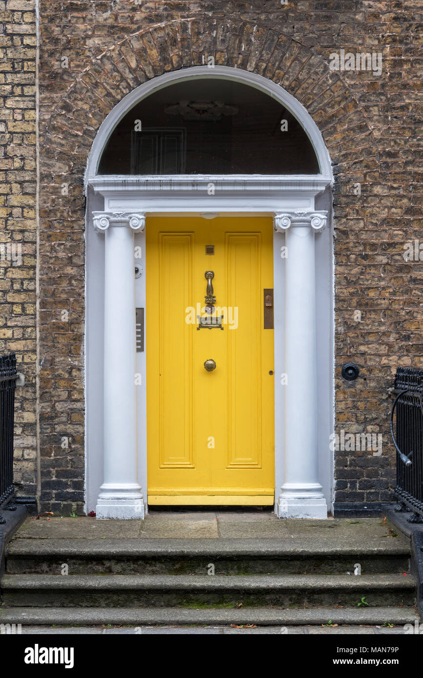 Yellow classic door in Dublin, example of typical architecture of Dublin, Ireland Stock