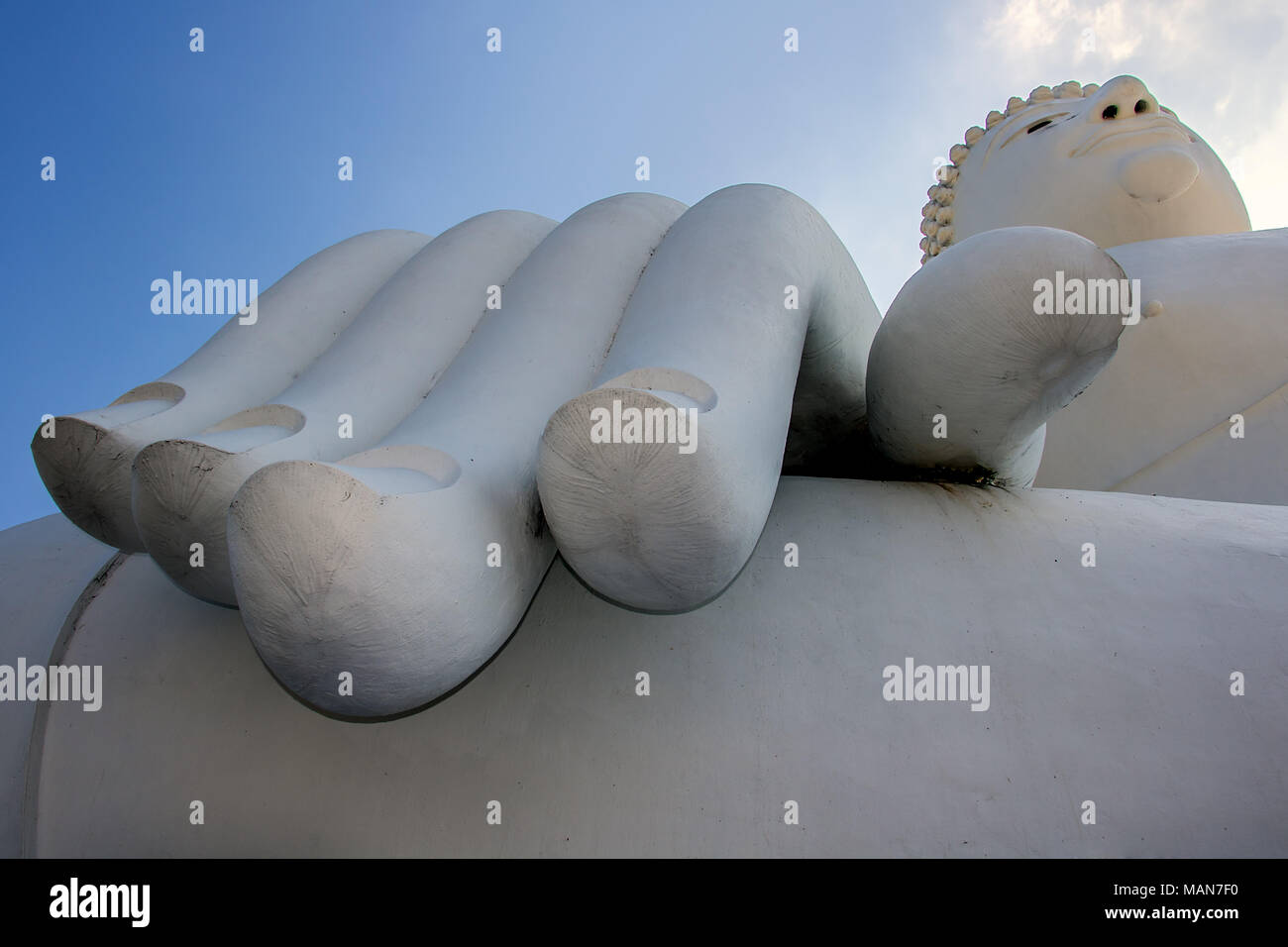 The great Buddha statue sitting under blue sky, detail with hand ...