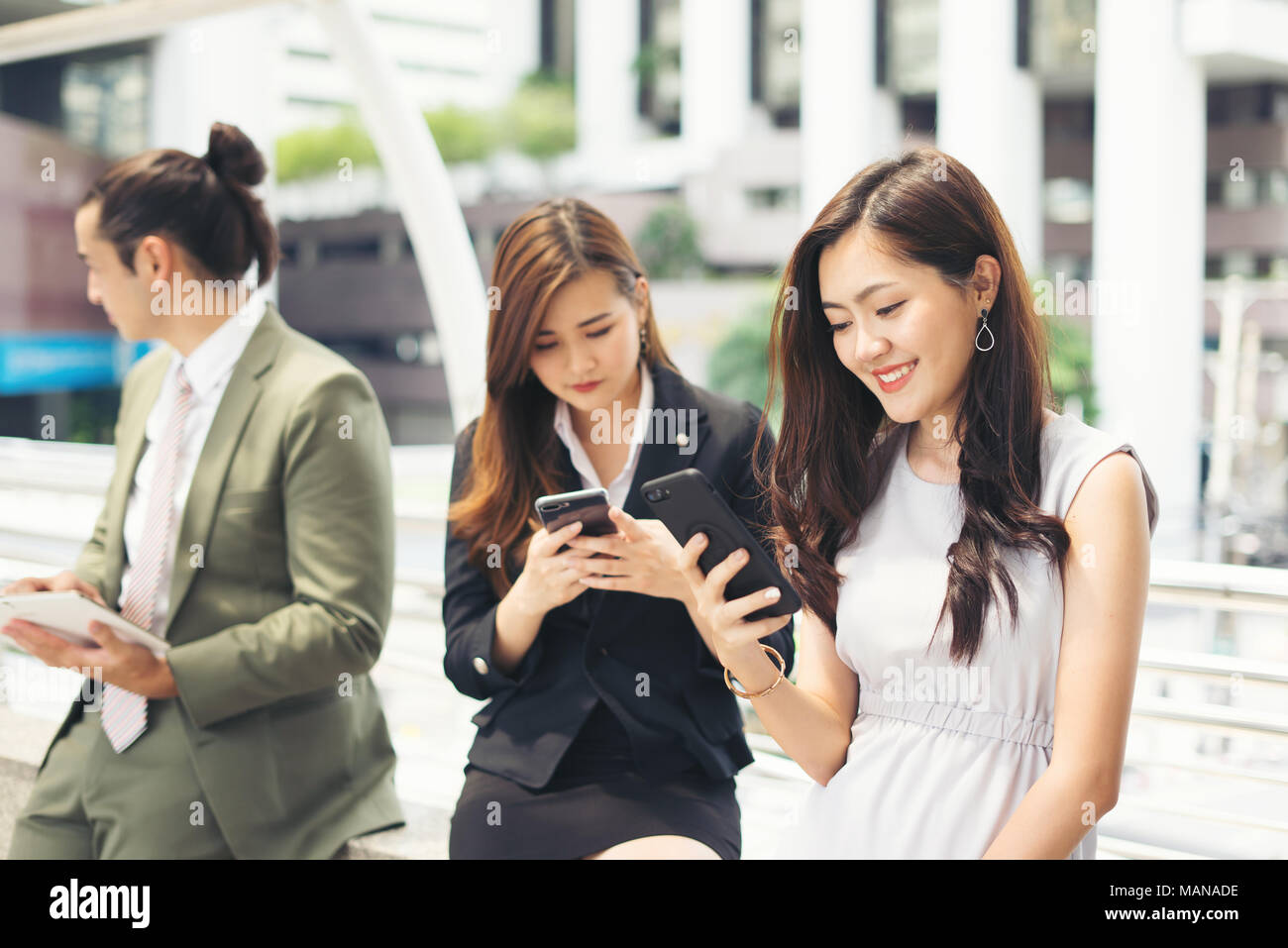 Business people using smartphone while together Stock Photo