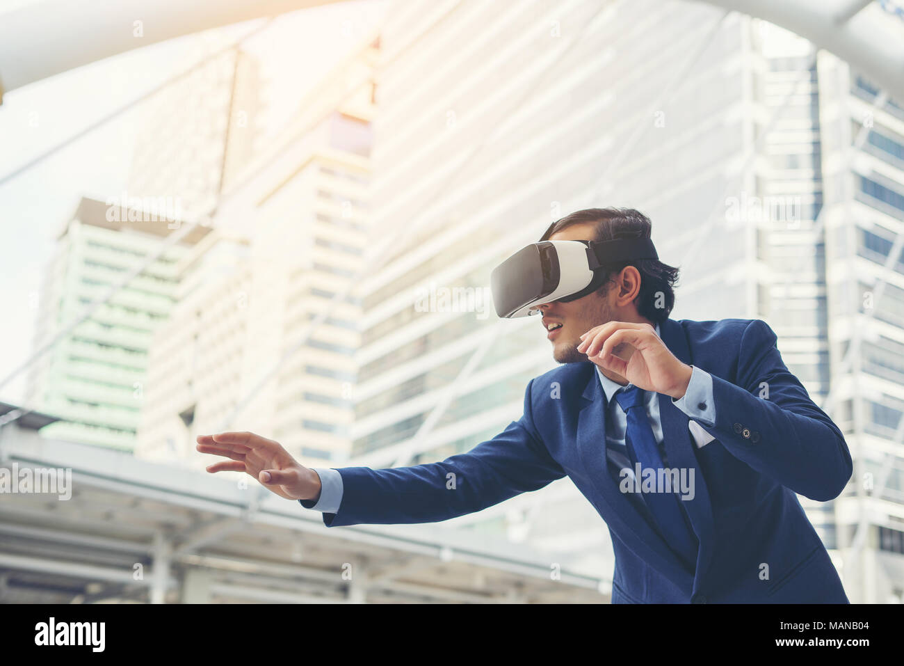 Young businessman in black suit wearing virtual reality goggles Stock ...