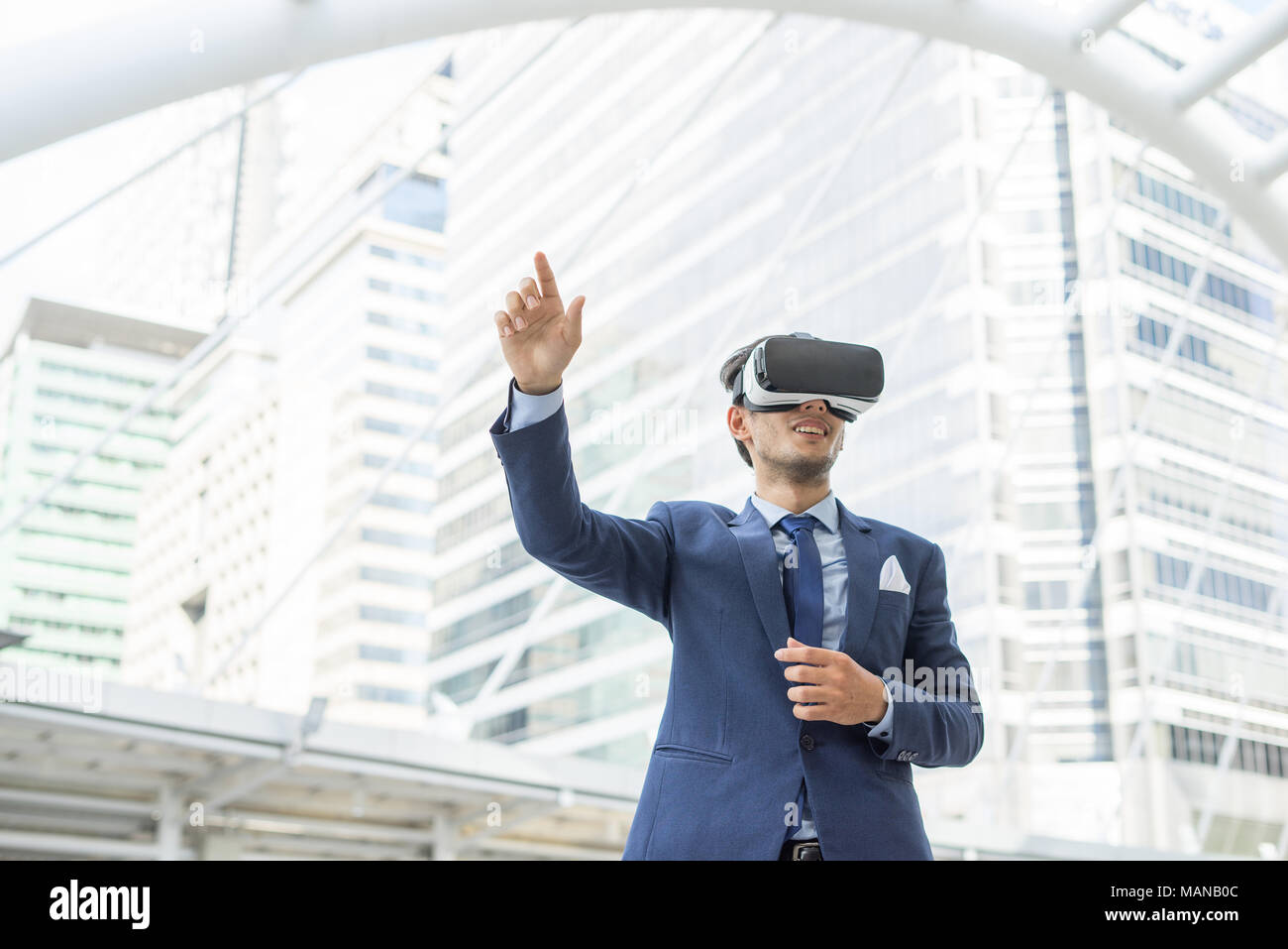 Young businessman in black suit wearing virtual reality goggles Stock ...
