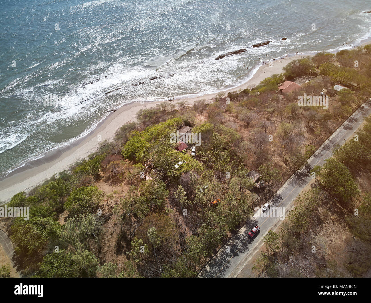 Summer vacation theme. Coastline of ocean with road aerial drone view Stock Photo