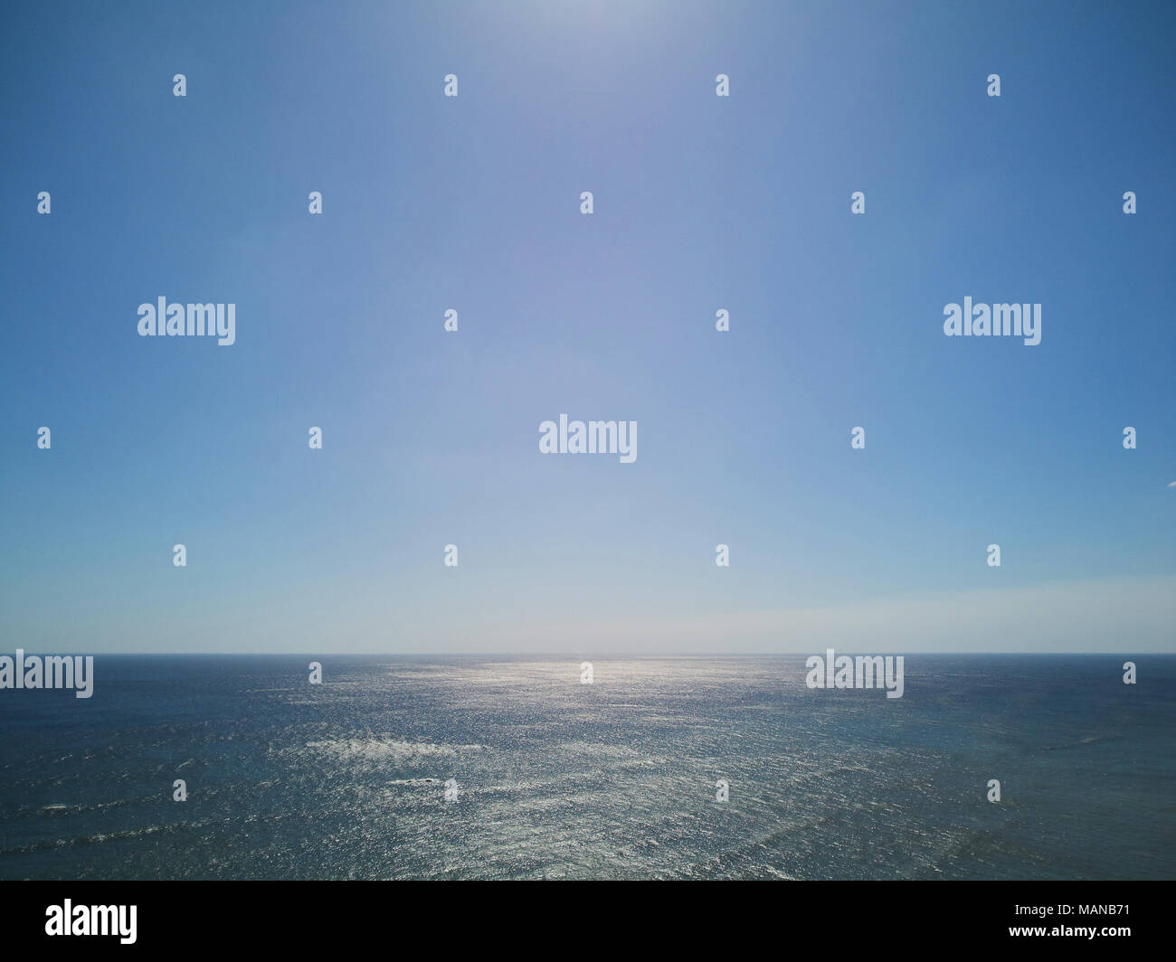 Ocean seascape on sunny day with clear blue sky Stock Photo - Alamy