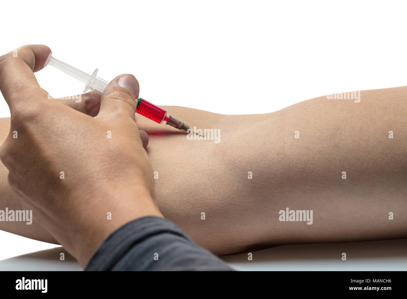 Man inject himself with drug by syringe Stock Photo