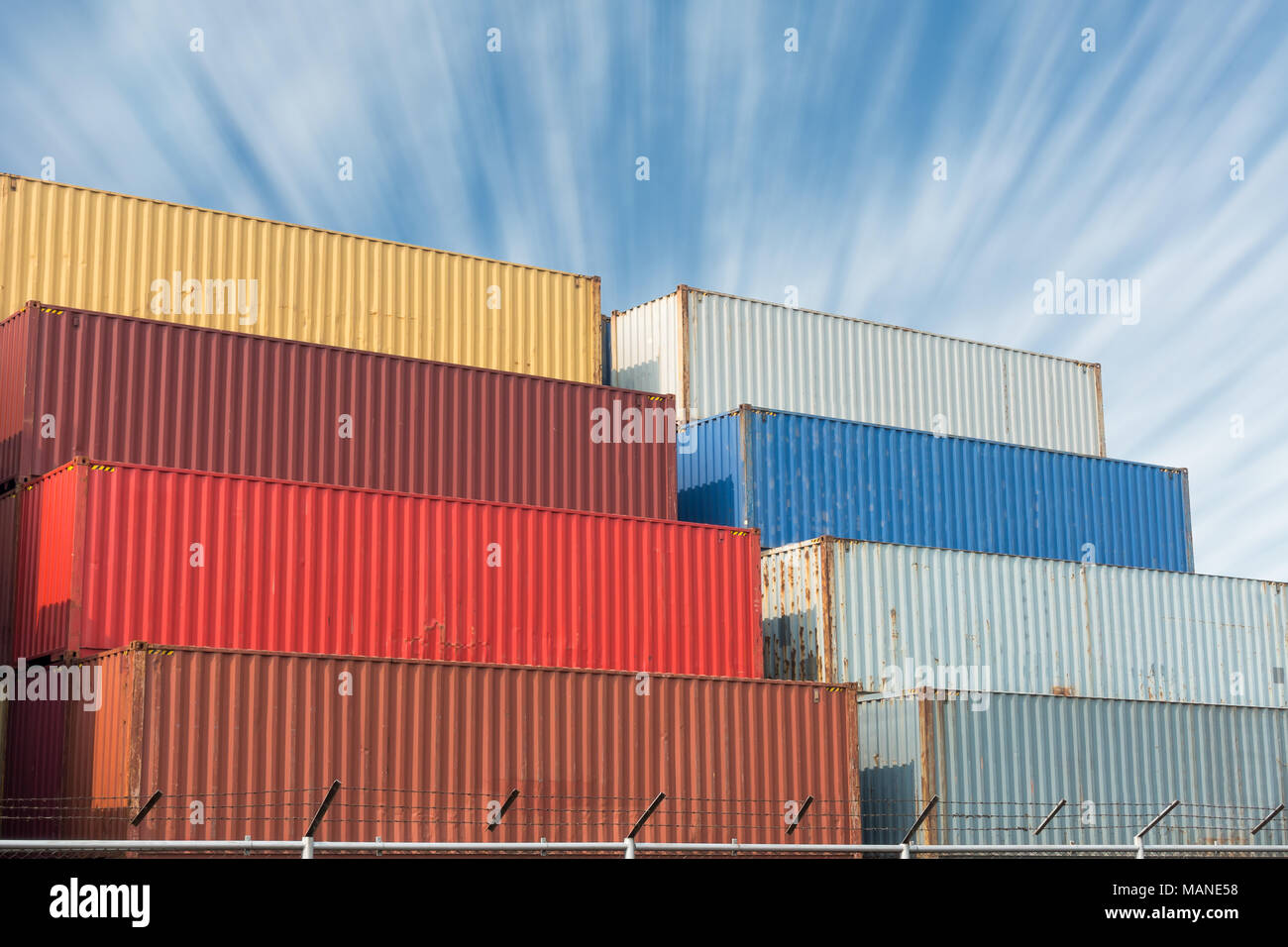 Colorful of container stack on blue skies backgroud Stock Photo - Alamy