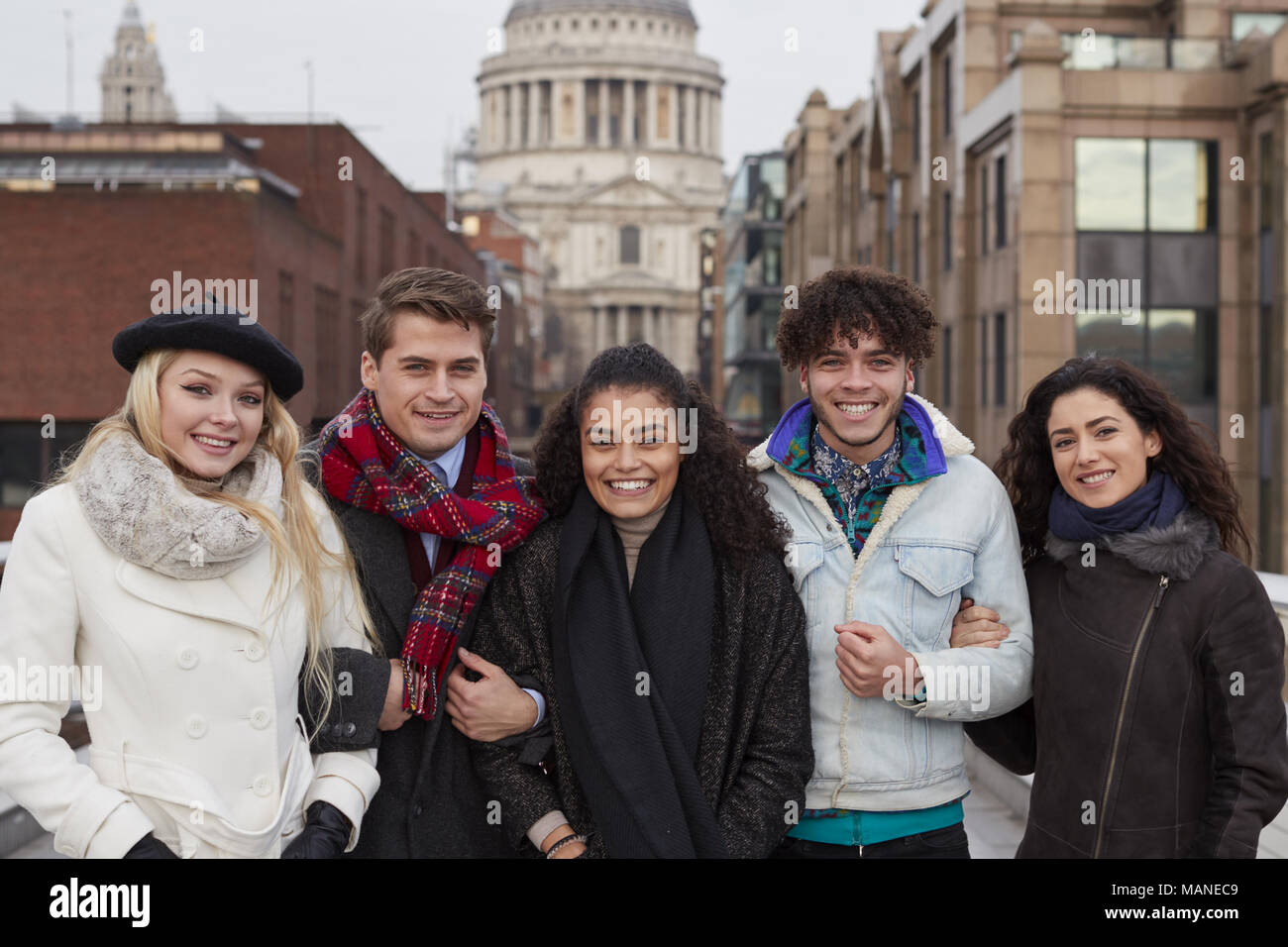 Portrait Of Young Friends Visiting London In Winter Stock Photo