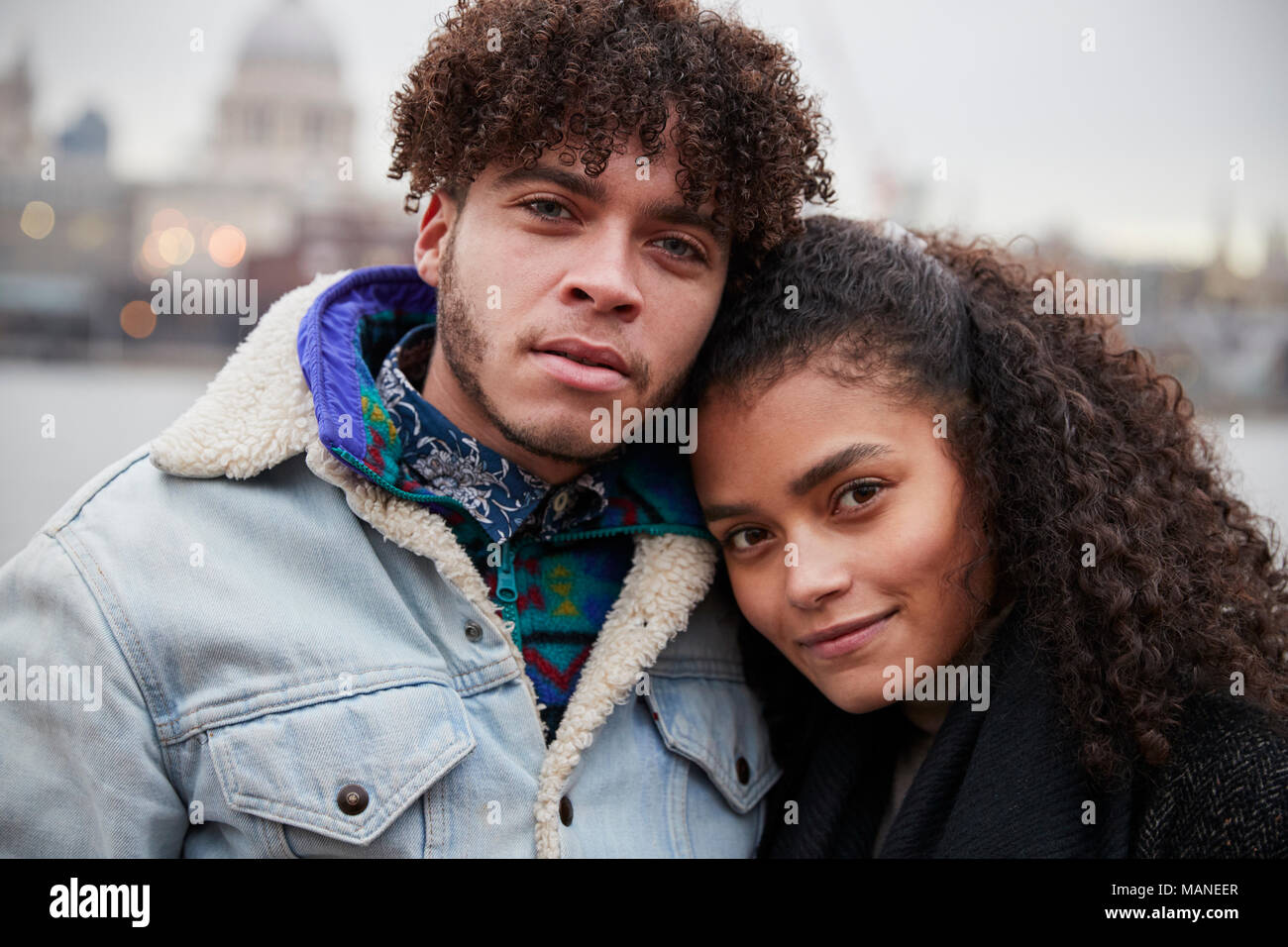 Portrait Of Couple Walking Along South Bank On Visit To London Stock Photo