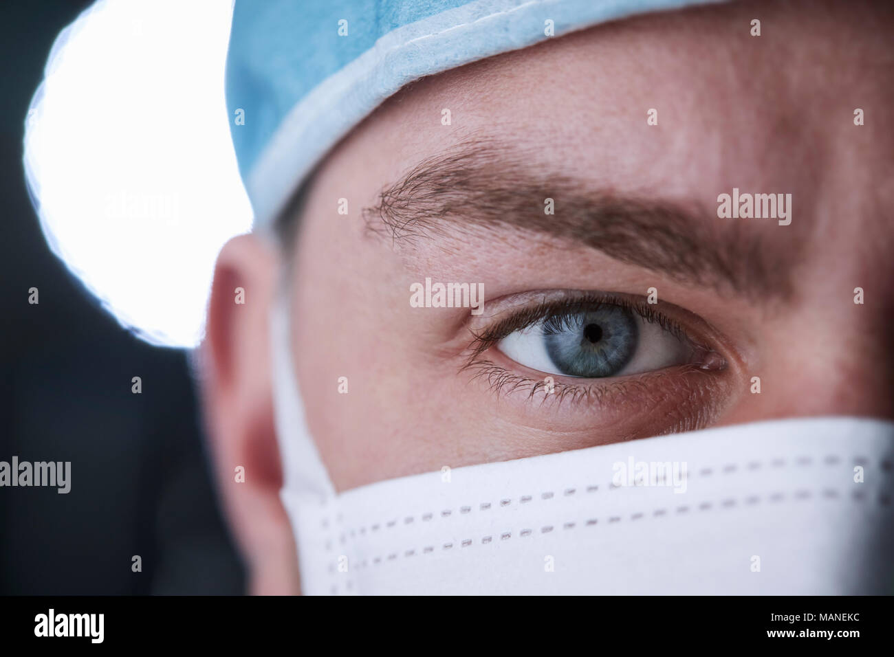 Male healthcare worker in scrubs head shot, close up crop Stock Photo