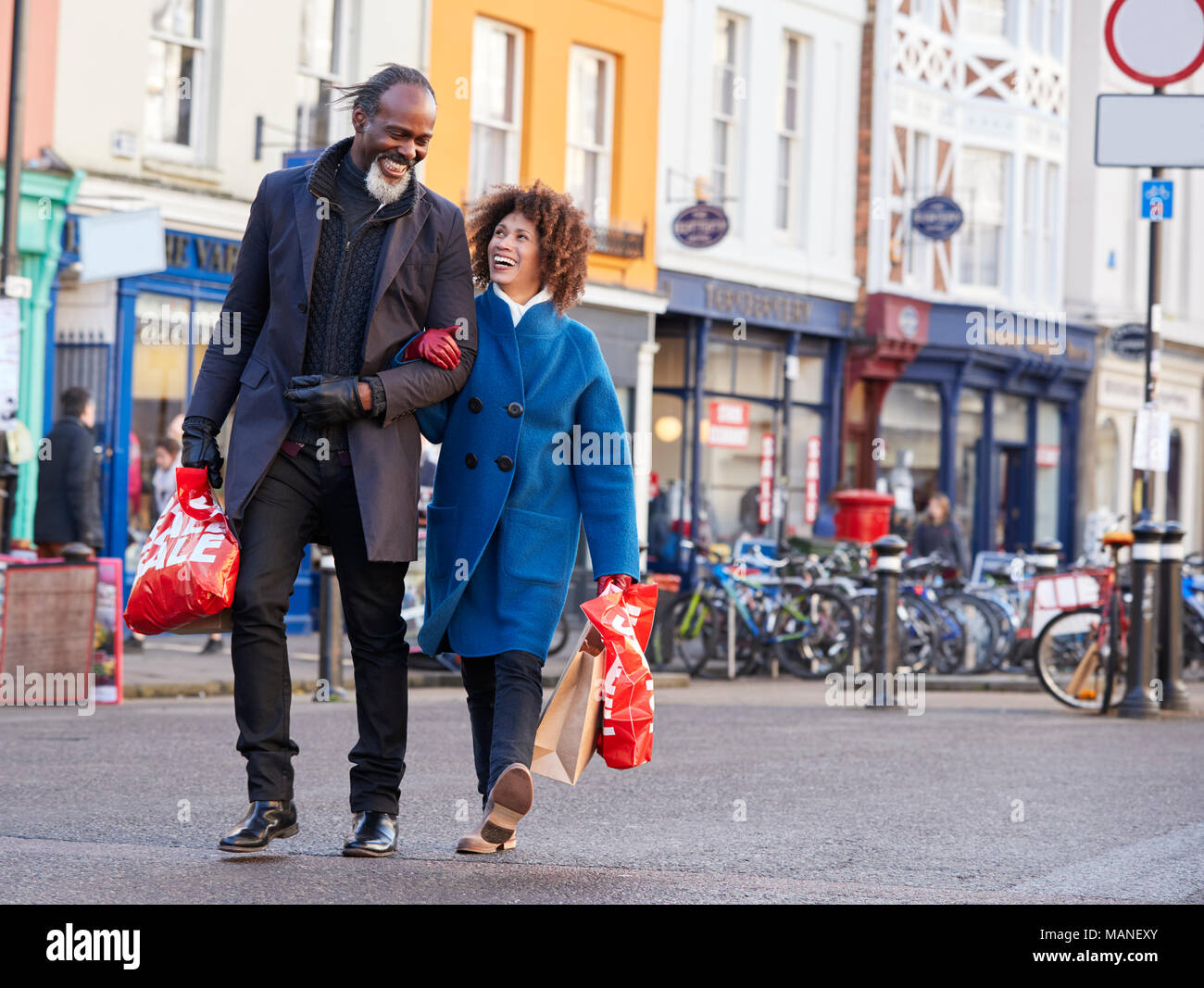 Mature Couple Enjoying Shopping In City Together Stock Photo