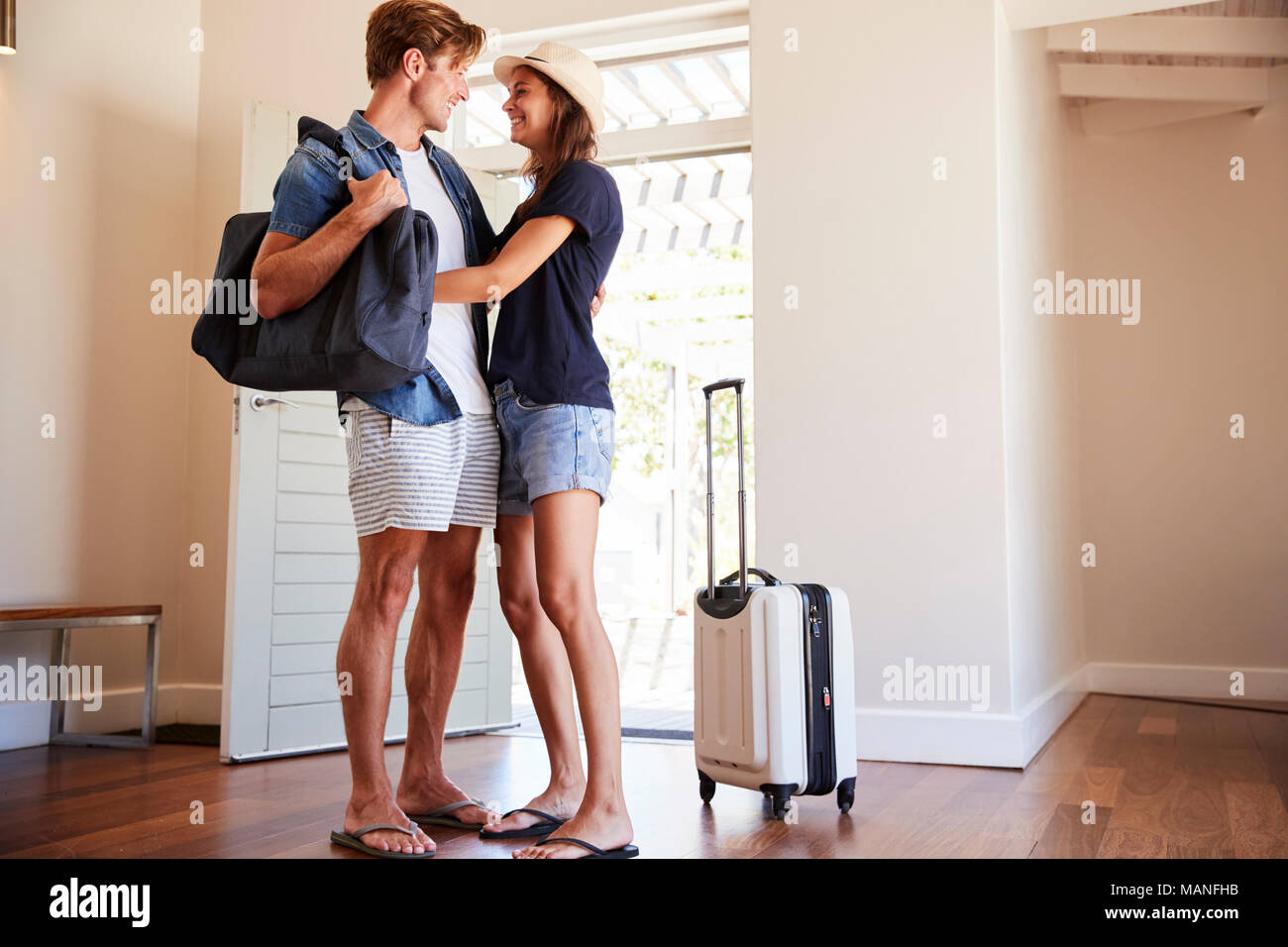 Couple Arriving At Summer Vacation Rental Stock Photo