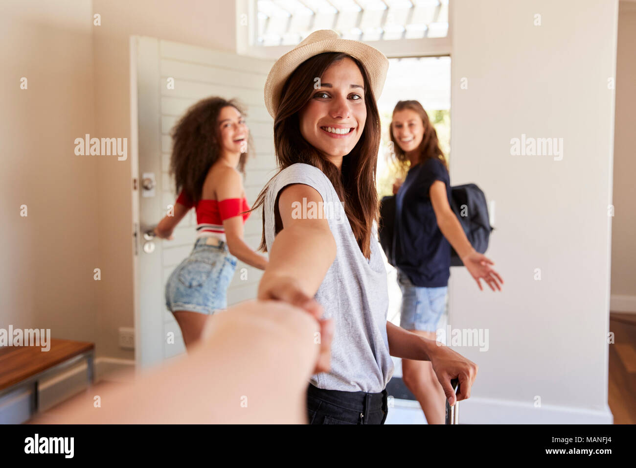 Point Of View Shot Of Female Friends Leaving Summer Rental Stock Photo