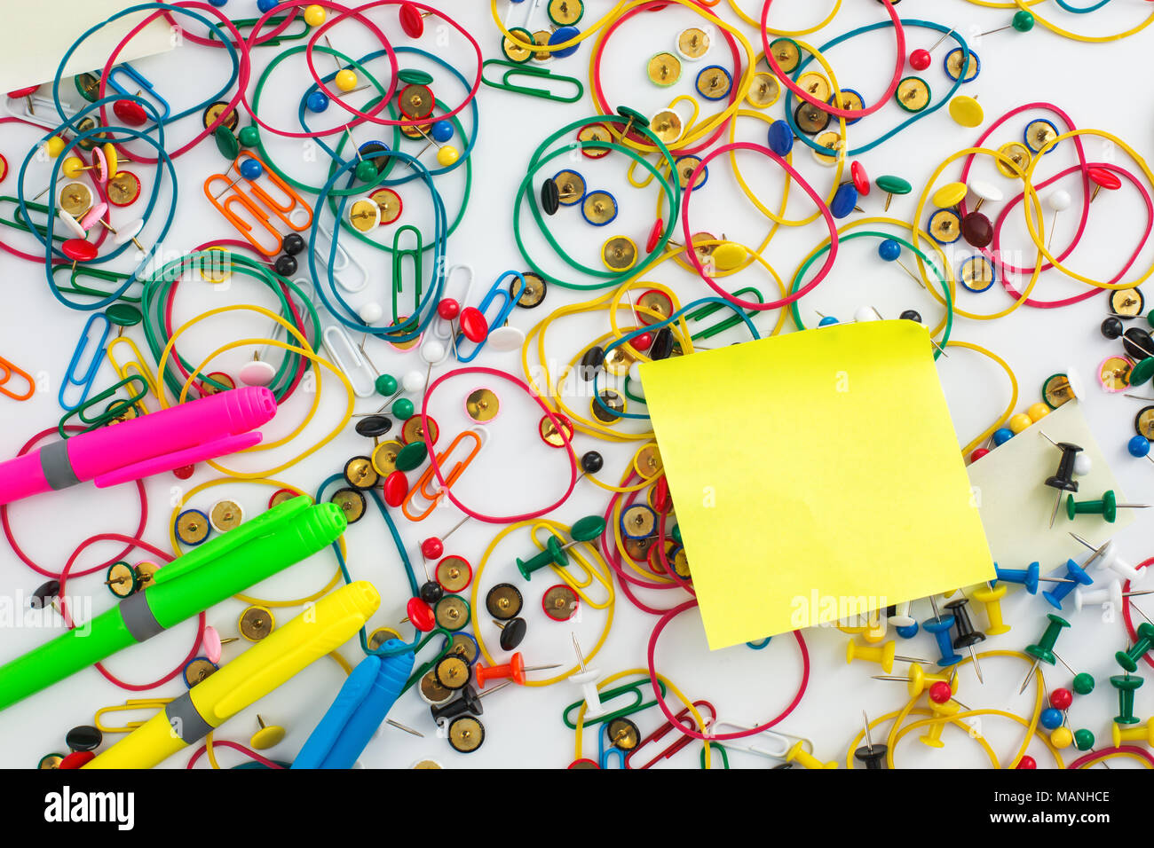 Colourful paper clips, elastic rubber bands, markers, drawing pins
