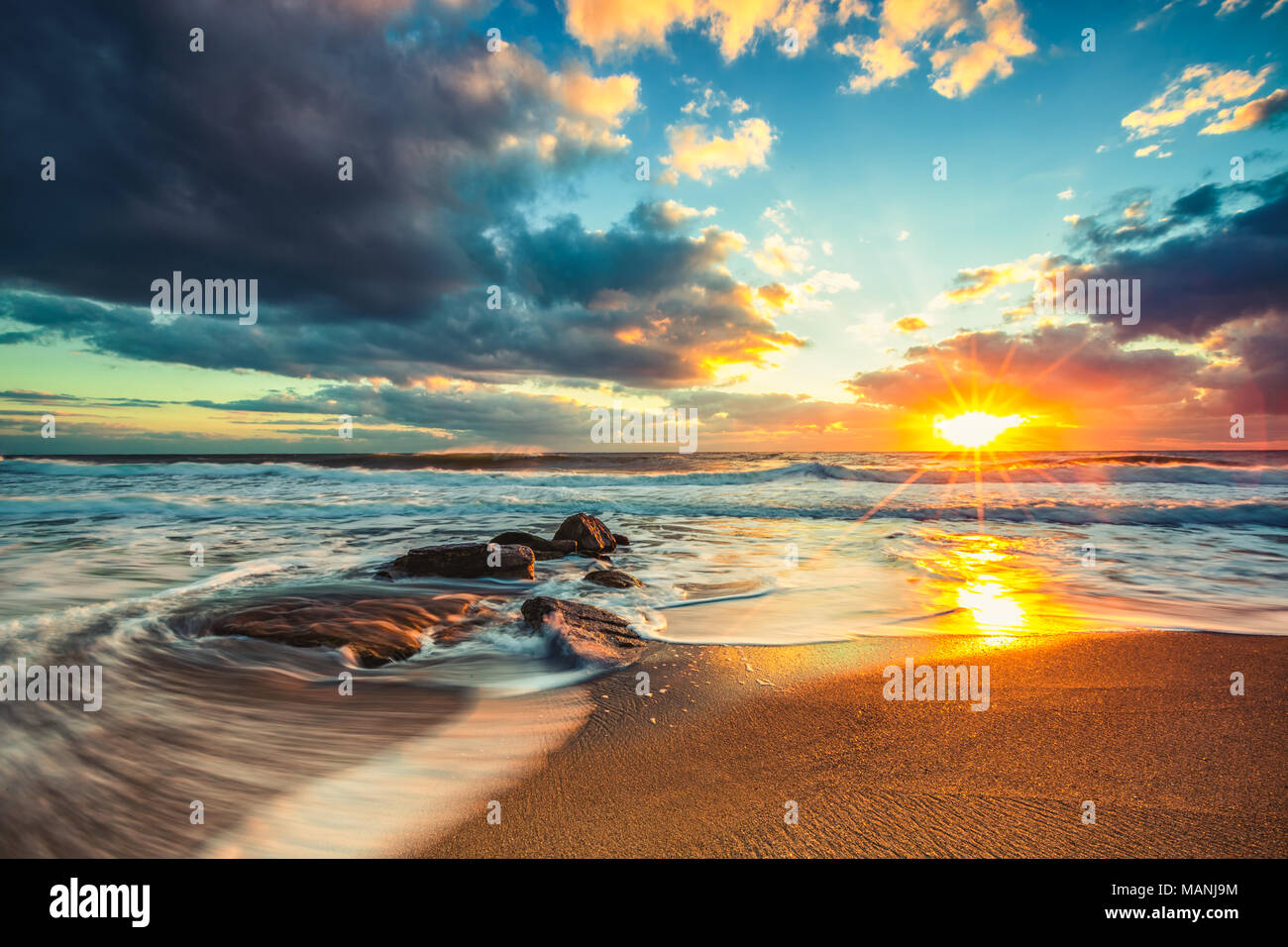 Beautiful cloudscape over the sea, sunrise shot Stock Photo - Alamy